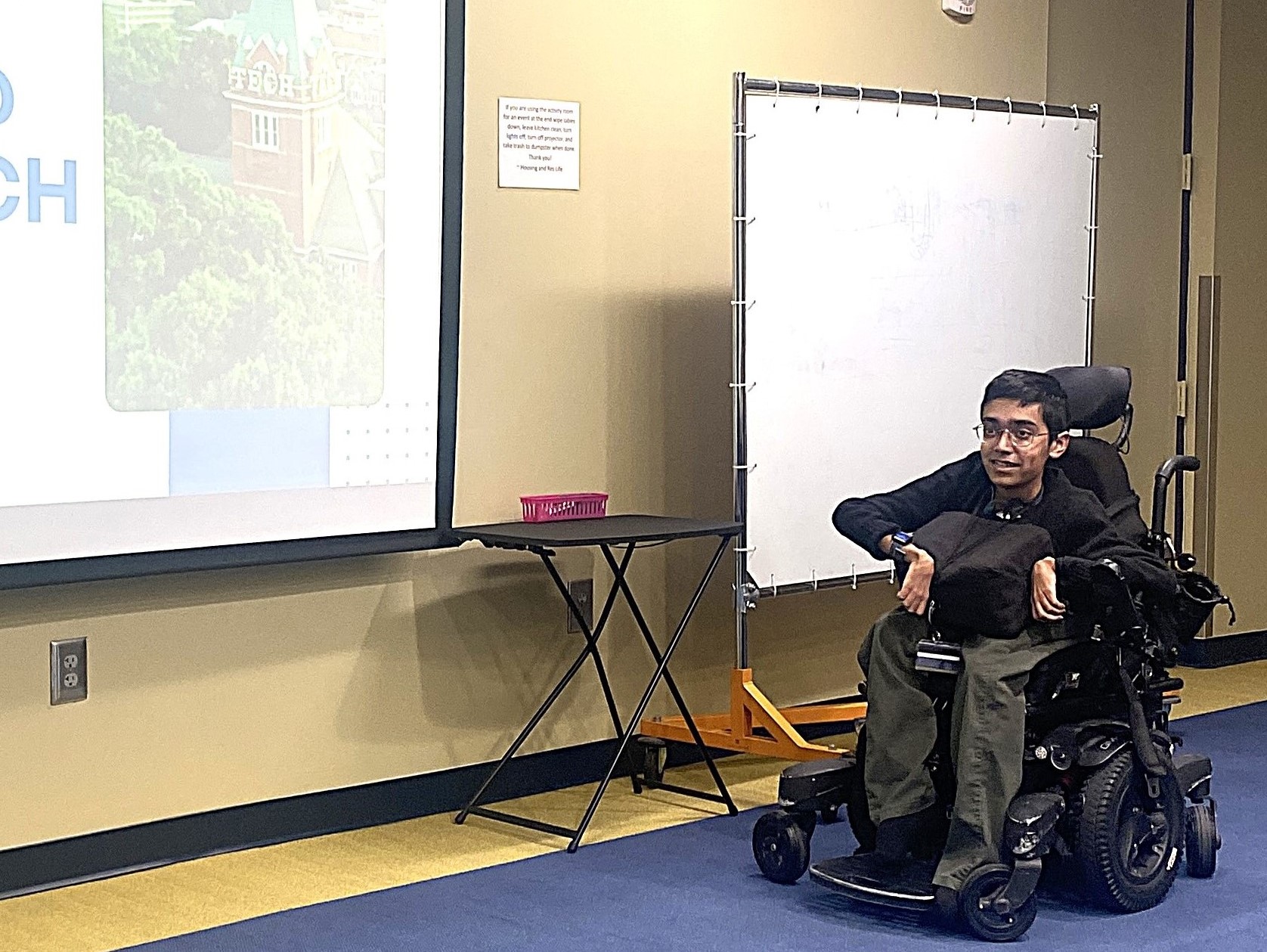 Aslam giving presentation on "Disability @ Georgia Tech" 