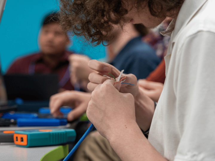 A student working on electrical cords. 