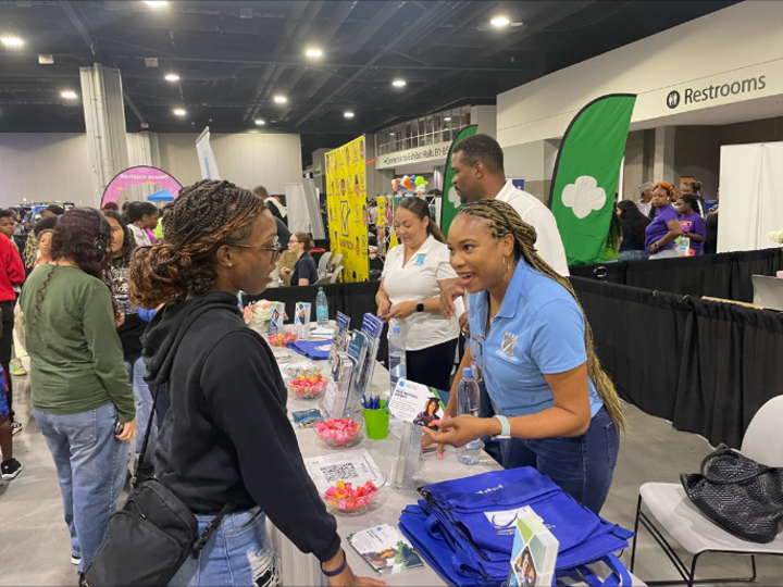 GVRA staff member is talking to a student about our services. 