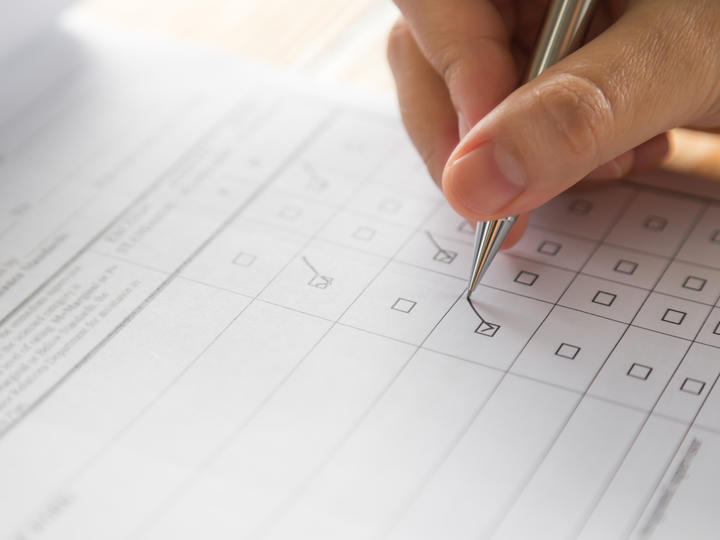 Person is filling out a form.