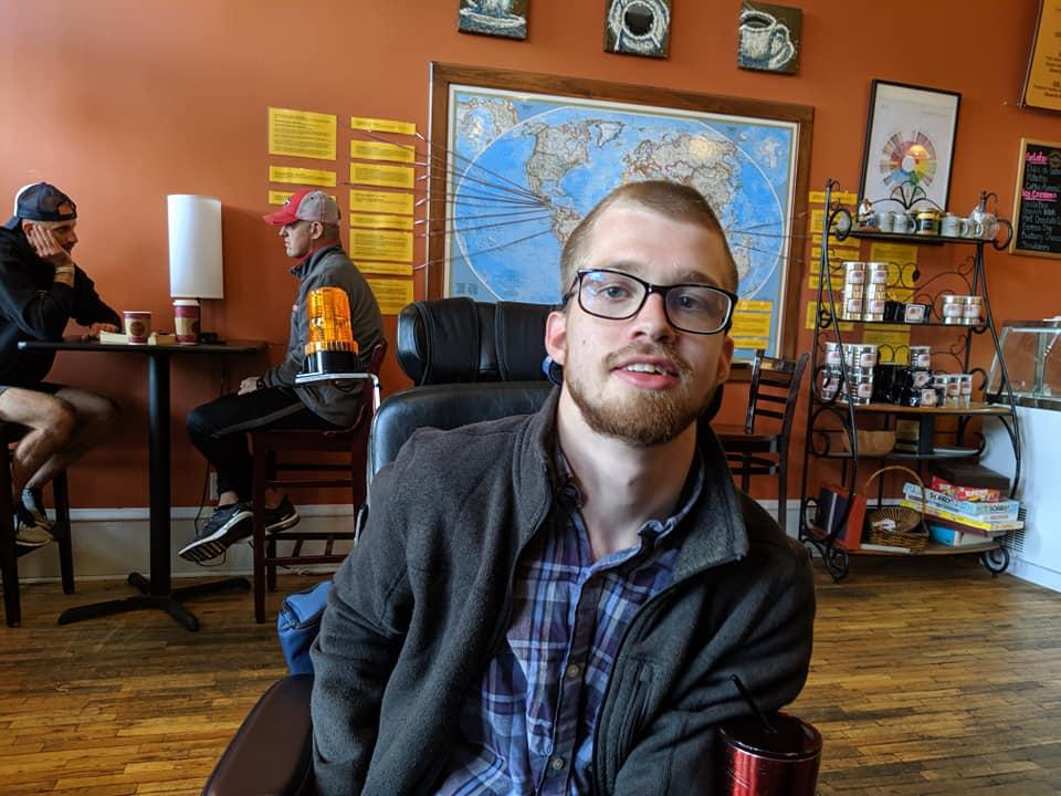 Cole Allen sits in a cafe in Carrollton