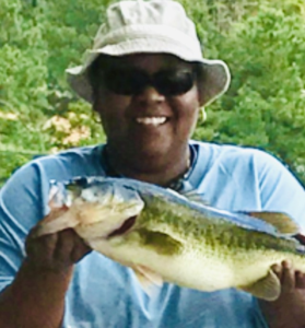 Celeste Harris holding a fish