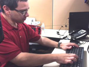 Hernando DelaCruz typing at a keyboard