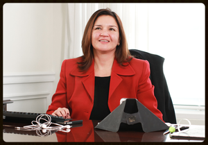 Shirley Robinson sitting at a desk