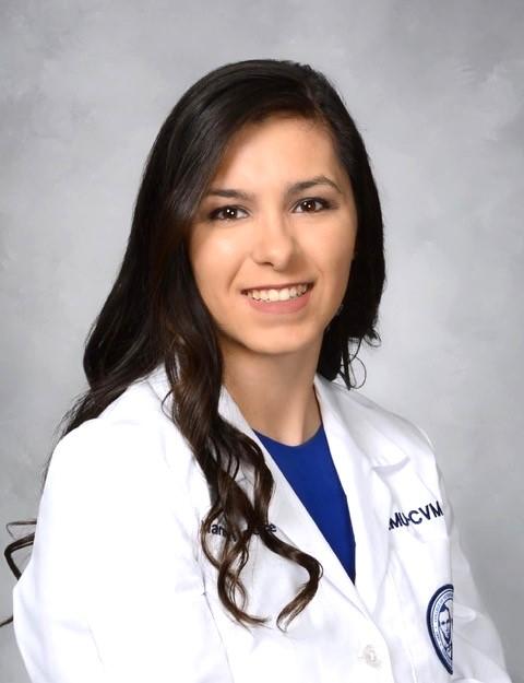 Headshot of Dr. Reece smiling in her white coat 