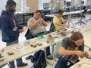 RWS students working on light electrical wires. 