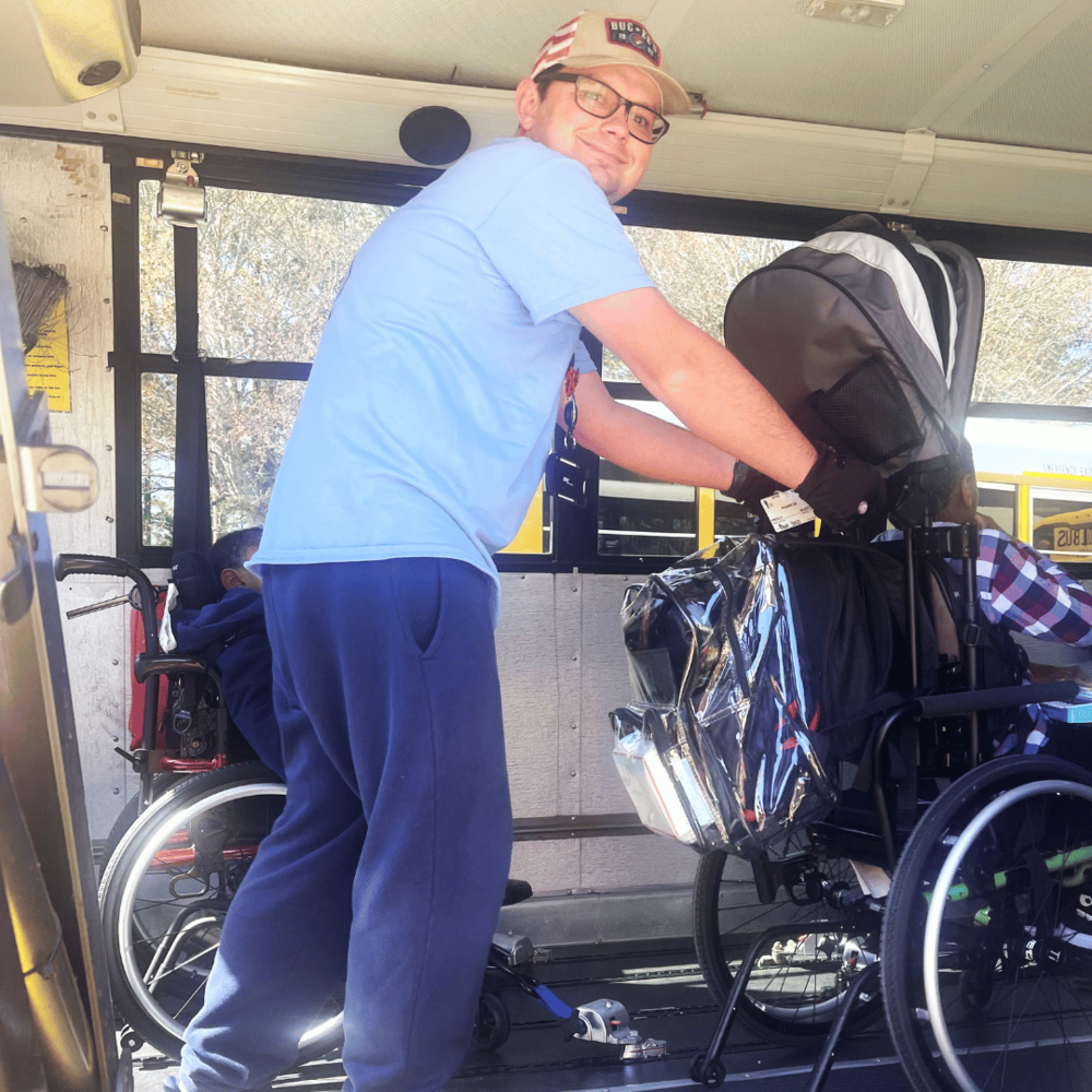One of Josh’s duties is to be sure all students are seated securely on the bus.&nbsp;&nbsp; &nbsp;