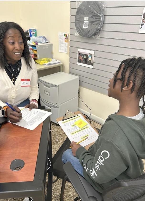 Woman Facilitator with student 