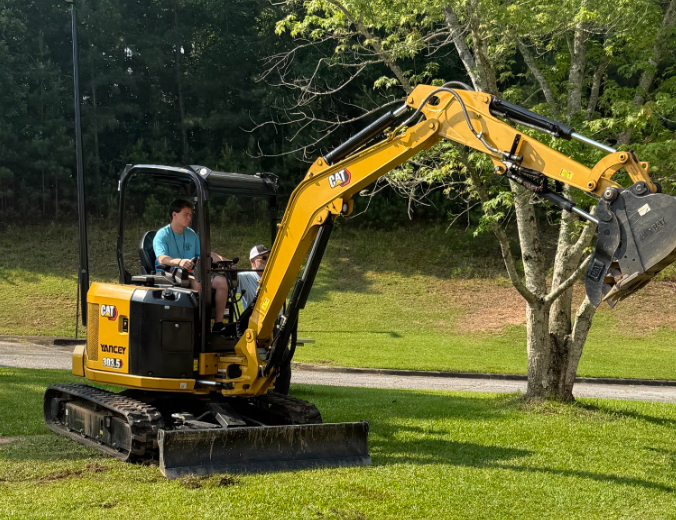 A person on a forklift. 