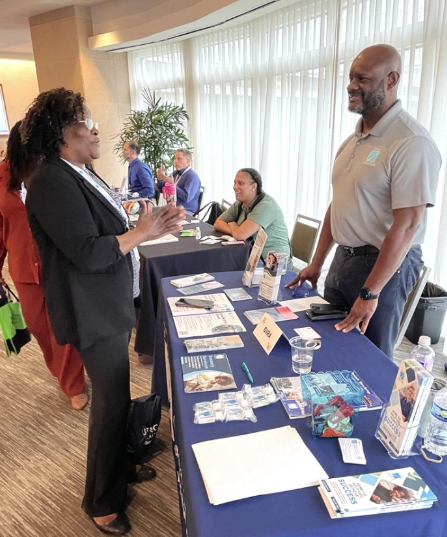 A GVRA counselor talking to a woman. 