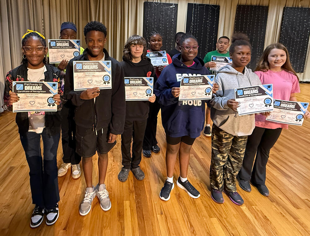 Group of students holding certificates 