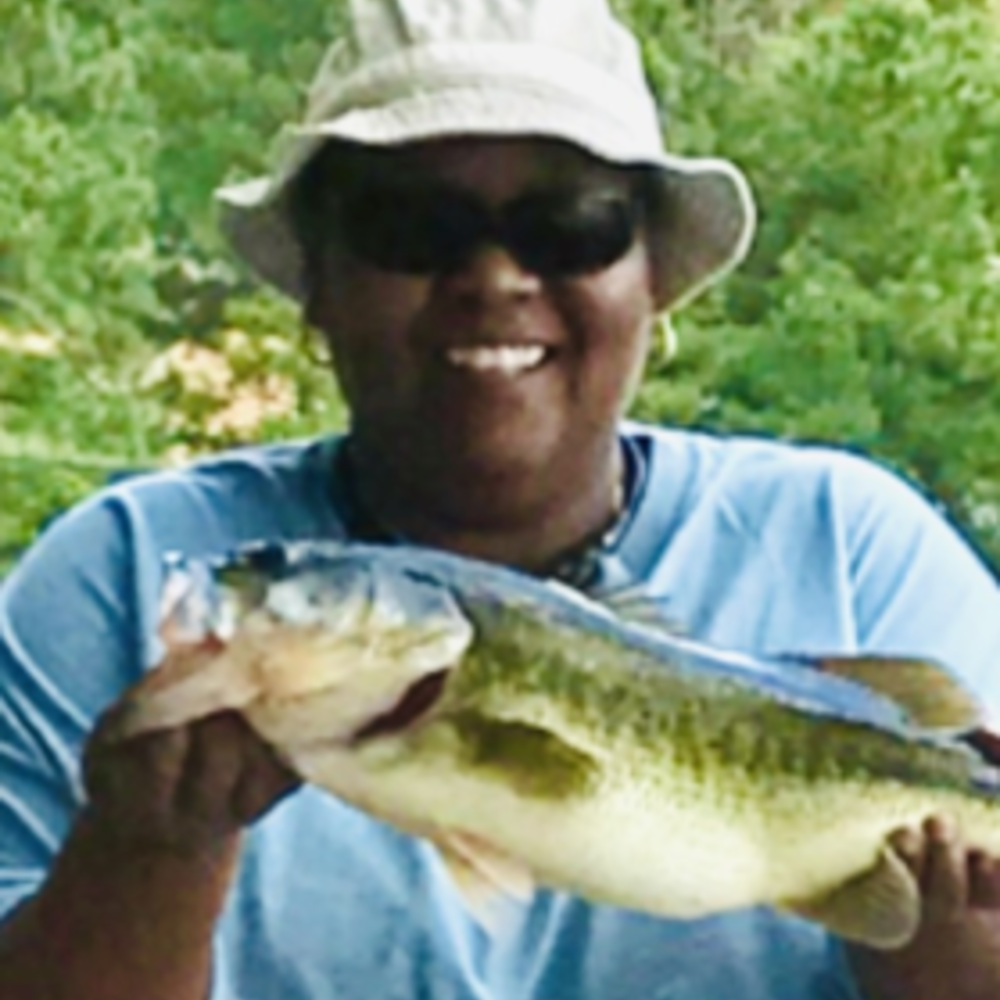 Headshot of woman holding a fish