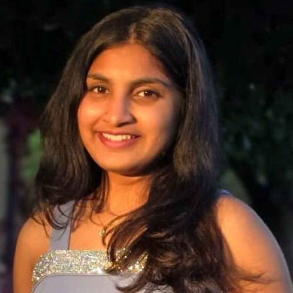 Woman of south Asian decent with dark brown shoulder length hair