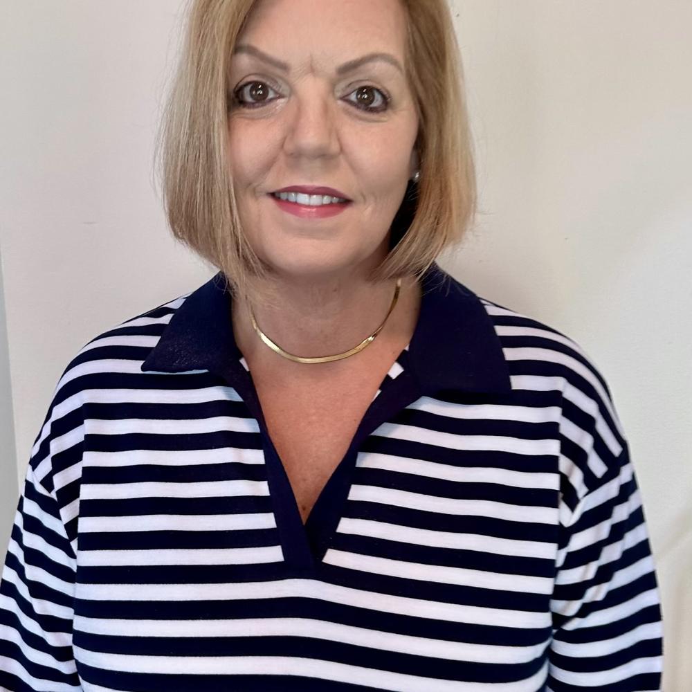 Headshot of woman with strawberry blonde hair