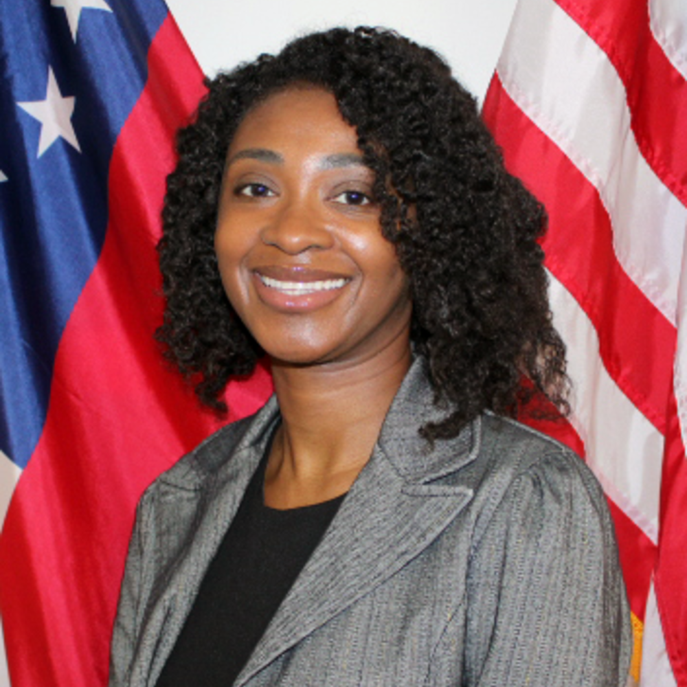 A headshot photo of a woman smiling. 